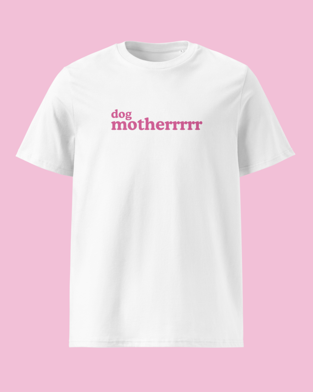 A white short-sleeve crewneck t-shirt with the text 'dog motherrrr' printed in pink across the chest, displayed against a solid pink background.